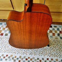 TOP単板のアコースティックギター（ケース付）の画像