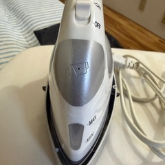 受取決定アイロンとアイロン台の画像