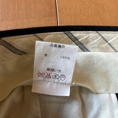 毛100%ブラックスラックスの画像