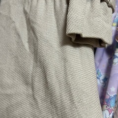 ベージュのコートの画像