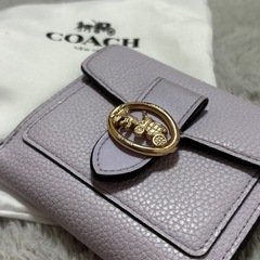 COACH コーチ パープル 二つ折り財布 袋付きの画像