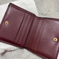 COACH コーチ パープル 二つ折り財布 袋付きの画像