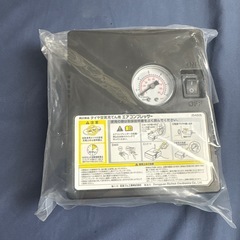 日産　純正　パンク修理キットの画像