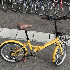 黄色折りたたみ中古自転車整備済自転車店の画像