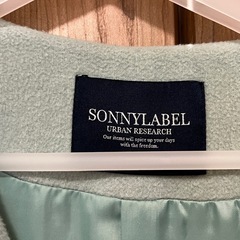 ミントグリーンのコクーンコートの画像