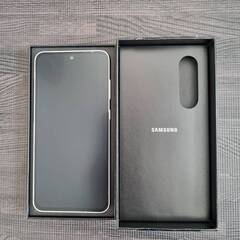 Samsung Galaxy S24FE 国内au版 ほぼ新品 ケース・フィルム付きの画像