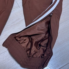 adidas ブラウン アディダス ウーブン ファイヤーバードトラックパンツの画像