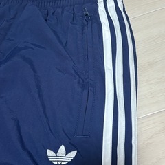 adidas アディダス ウーブン ファイヤーバードトラックパンツ紺の画像