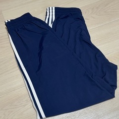 adidas アディダス ウーブン ファイヤーバードトラックパンツ紺の画像