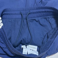 adidas アディダス ウーブン ファイヤーバードトラックパンツ紺の画像