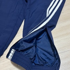 adidas アディダス ウーブン ファイヤーバードトラックパンツ紺の画像