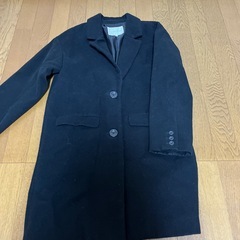 黒色ロングコートの画像