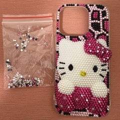 iPhone16proケース ハローキティデコ電200円の画像