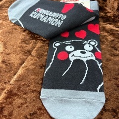 ノート、クリアファイル、ボールペン、靴下の画像