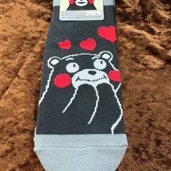 ノート、クリアファイル、ボールペン、靴下の画像