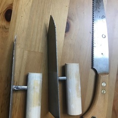 左官鏝とノコギリの画像
