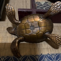 銅器置き物取り引き決定の画像