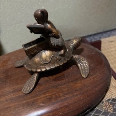 銅器置き物取り引き決定の画像