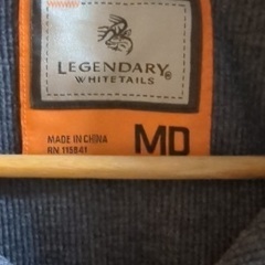 オレンジのチェック柄ポロシャツの画像