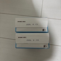 粉ミルク缶とスティックの画像