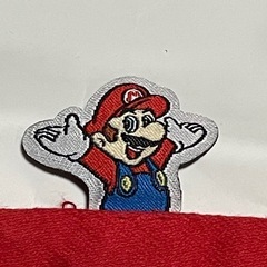 スーパーマリオ ハンドタオル マリオ帽子＆ロゴ総柄【新品未使用】の画像