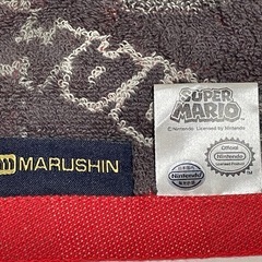 スーパーマリオ ハンドタオル マリオ帽子＆ロゴ総柄【新品未使用】の画像