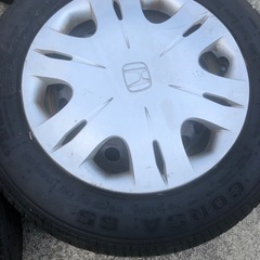タイヤ4本セット　ホンダ純正ホイールカバー付の画像