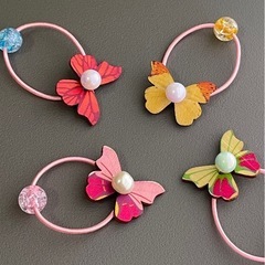 カラフルな蝶と花のヘアゴム8個セット（ベビー・キッズヘアゴム①)の画像