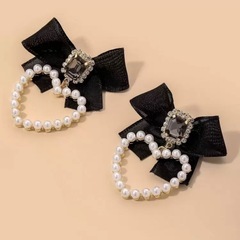 黒 リボン パール ピアスの画像