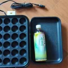 ホットプレートとたこ焼き24個分の画像