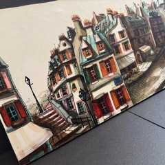80x40.建物が密集した街並みが描かれた、独特なスタイルの絵画作品です。の画像