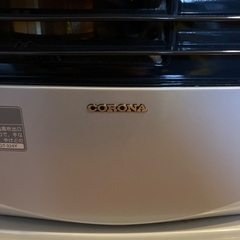 石油ファンヒーターと灯油ポリタンクの画像