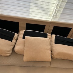 ベージュ L字型ソファ 布製 付属クッションありの画像