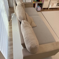 ベージュ L字型ソファ 布製 付属クッションありの画像