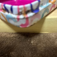 コーチの入れ物とメモ帳とシールの画像