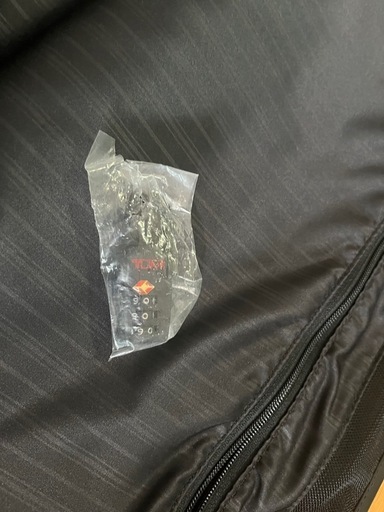 TUMI. 本革スーツ入れ