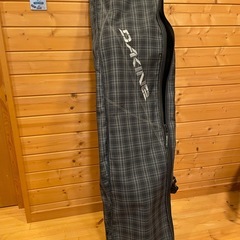 スノーボード（ビンディング付き）ケース入りの画像