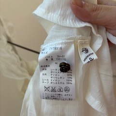 axesのペプラムトップスの画像