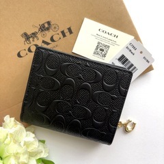 COACH ブラック デボスドシグネチャー 二つ折財布 【未使用】の画像