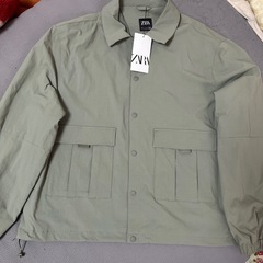 新品タグ付きZARAジャンバーLサイズの画像