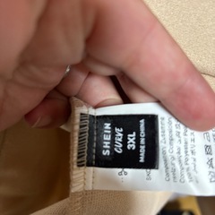 ベージュロングコートの画像