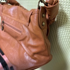 リボン茶色バッグの画像