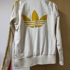 adidasトラックジャケットM　白金　オレンジ柄の画像