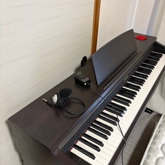 電子ピアノ（木製・3本ペダル）ヘッドホン付きの画像