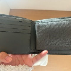 COACH グレー 二つ折り財布 保存袋付きの画像