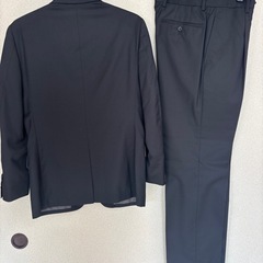 メンズ　スーツ　黒　フォーマルの画像