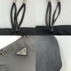 PRADA プラダハンドバッグ トートバッグ 腕掛け テスートナイロン レザー 本革 ブラック 黒 メタルハンドルトライアングル 三角ロゴプレート 白タグ バケツ型 大容量 軽量 通勤 通学 ビジネス レディース メンズ ユニセックスの画像