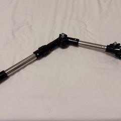 ベビーカーや自転車に傘を固定する器具の画像