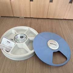 犬　餌やり機の画像