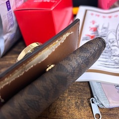 財布マイケルコース 裂け目あり、、の画像